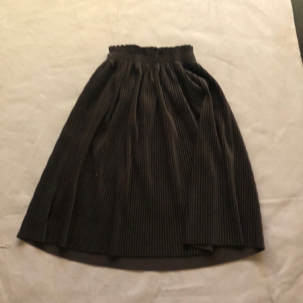 Dark green, a little above knee length, stretchy